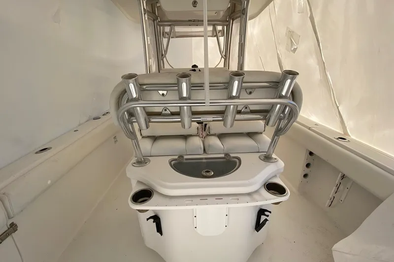 Slide: The Image of 2014 Sportsman Heritage 251 Center Console interior with rod holders and seating. - 6