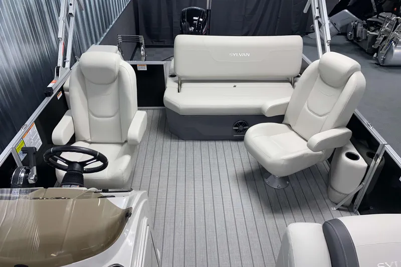 Slide: The Image of 2026 Sylvan Mirage 8520 CLZ DH pontoon boat interior with plush seating and modern design. - 5