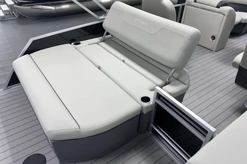 Slide: The Image of 2026 Sylvan Mirage 8520 CLZ DH pontoon boat interior with plush seating and cup holders. - 6