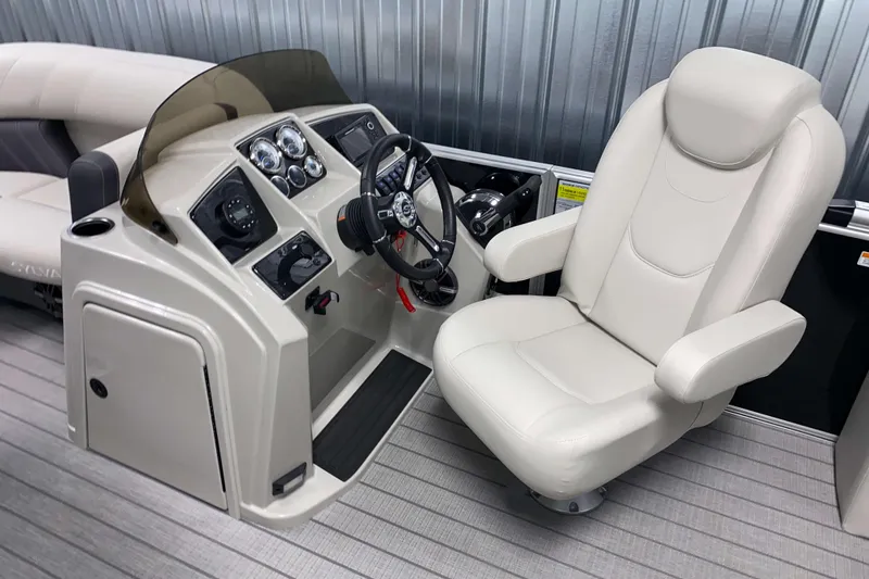 Slide: The Image of Captain's chair and helm of 2026 Sylvan Mirage 8520 CLZ DH pontoon boat. - 8