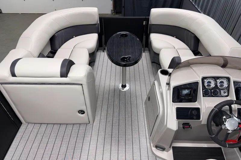 Slide: The Image of Interior of 2026 Sylvan Mirage 8520 CLZ DH PTS Tritoon with plush seating and modern dashboard. - 13