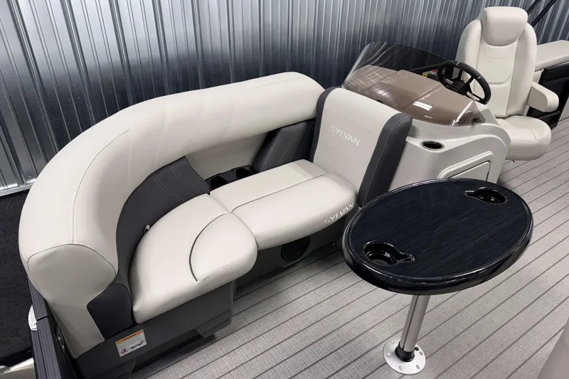 Slide: The Image of Luxurious seating on 2026 Sylvan Mirage 8520 CLZ DH PTS Tritoon with sleek table design. - 15