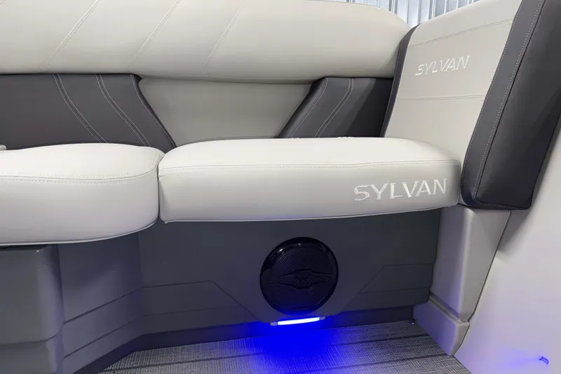 Slide: The Image of 2026 Sylvan Mirage 8520 CLZ DH PTS Tritoon interior seating with logo and ambient lighting. - 16
