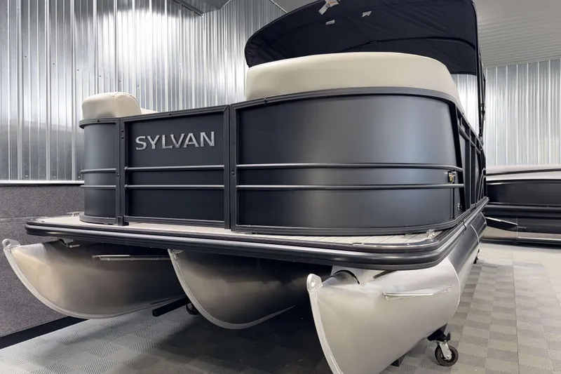 Slide: The Image of 2026 Sylvan Mirage 8520 CLZ DH PTS Tritoon in showroom, showcasing sleek design and modern features. - 19