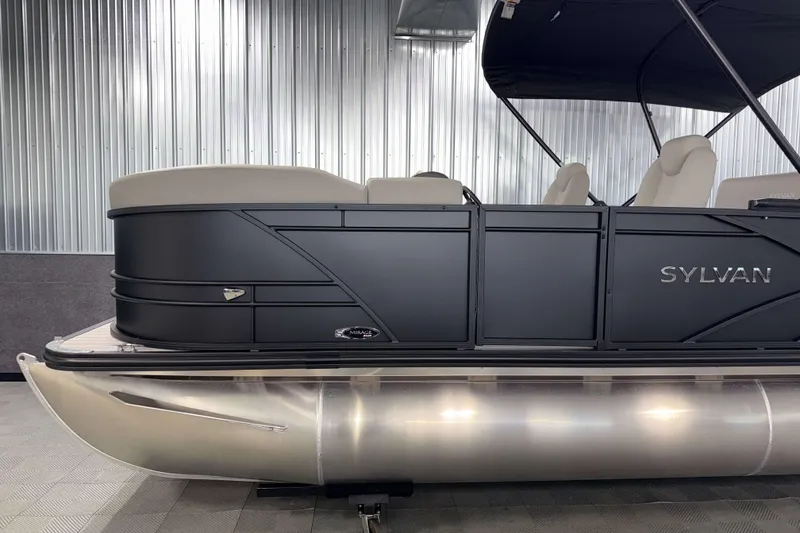 Slide: The Image of 2026 Sylvan Mirage 8520 CLZ DH PTS Tritoon, sleek black design, luxury seating. - 20