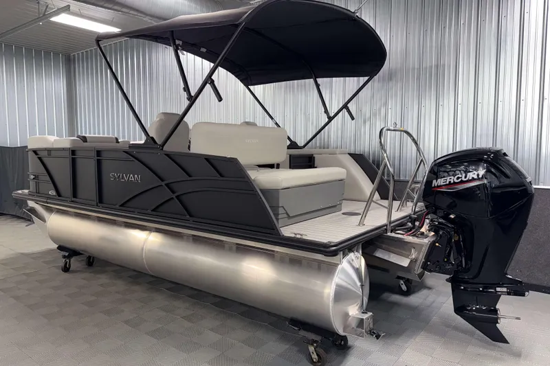 Slide: The Image of 2026 Sylvan Mirage 8520 CLZ DH PTS Tritoon with Mercury outboard in showroom. - 23