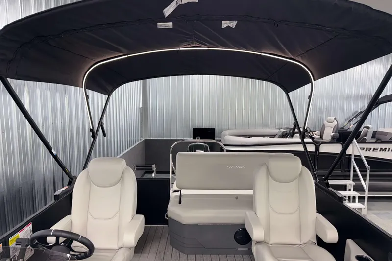 Slide: The Image of 2026 Sylvan Mirage 8520 CLZ DH PTS Tritoon interior with seating and canopy. - 25