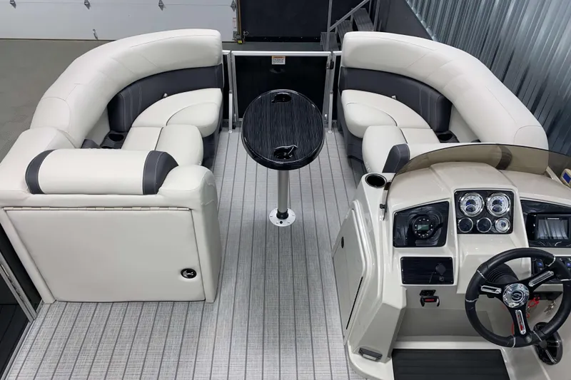 Slide: The Image of Captain's chair and helm of 2026 Sylvan Mirage 8520 CLZ DH PTS Tritoon boat. - 4