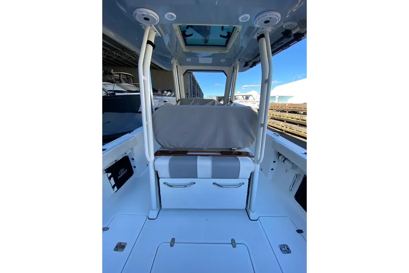 Slide: The Image of 2020 Pursuit S 288 Sport boat interior with seating and storage compartments. - 11