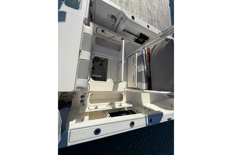Slide: The Image of 2020 Pursuit S 288 Sport boat interior with seating and storage compartments. - 14