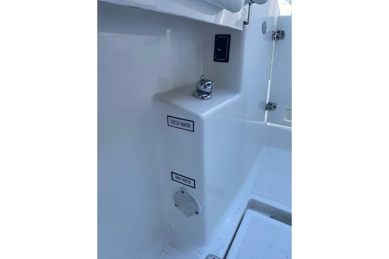 Slide: The Image of 2020 Pursuit S 288 Sport boat water system with fresh and raw water access. - 15