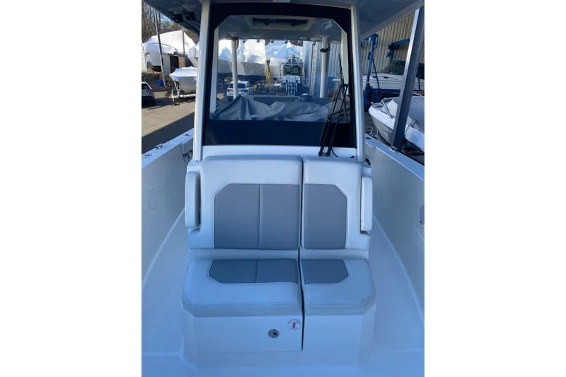 Slide: The Image of 2020 Pursuit S 288 Sport boat interior with dual seating and protective cover. - 16