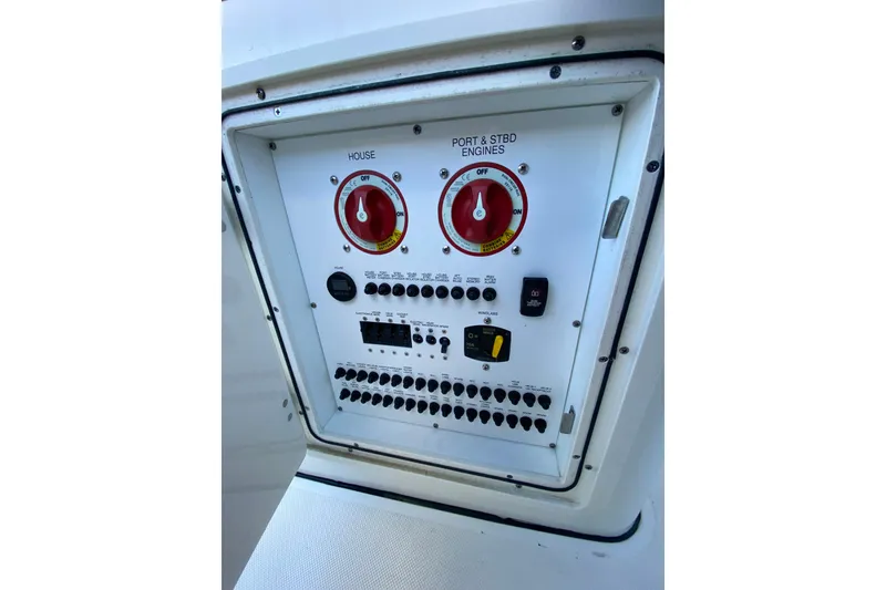 Slide: The Image of Control panel of 2020 Pursuit S 288 Sport boat with switches and dials. - 26