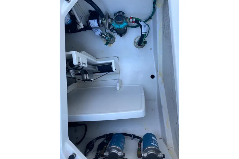 Slide: The Image of 2020 Pursuit S 288 Sport boat interior showing mechanical components and wiring. - 27