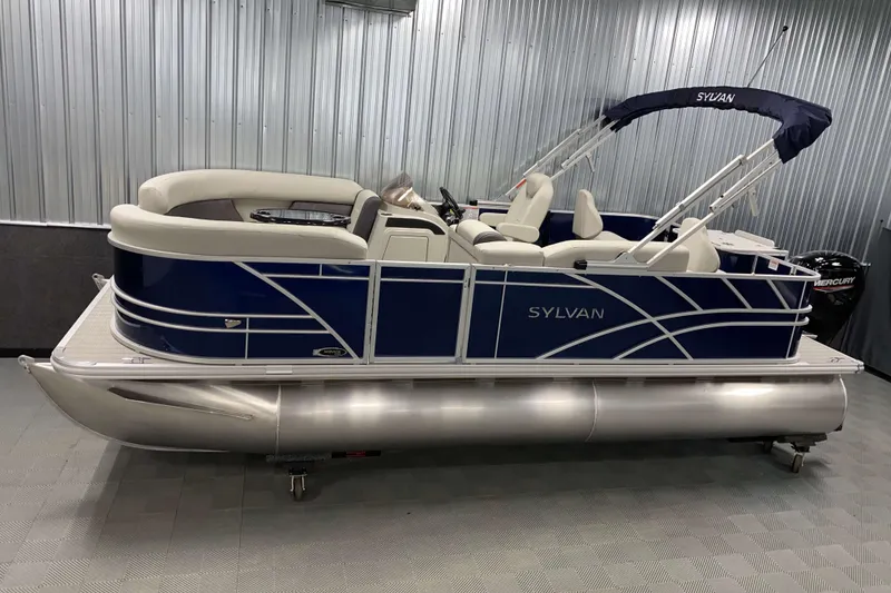 The Image of 2026 Sylvan Mirage Fish 8520 Party Fish pontoon boat in a showroom setting. - 0