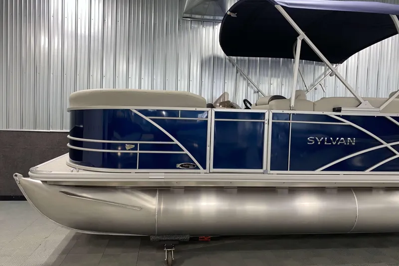 Slide: The Image of 2026 Sylvan Mirage Fish 8520 Party Fish pontoon boat in a showroom. - 17