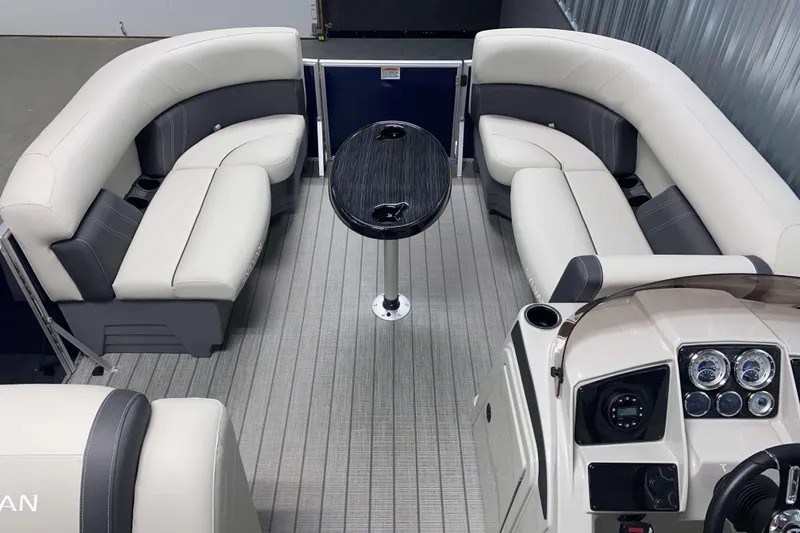 Slide: The Image of 2026 Sylvan Mirage Fish 8520 Party Fish interior with plush seating and modern dashboard. - 4