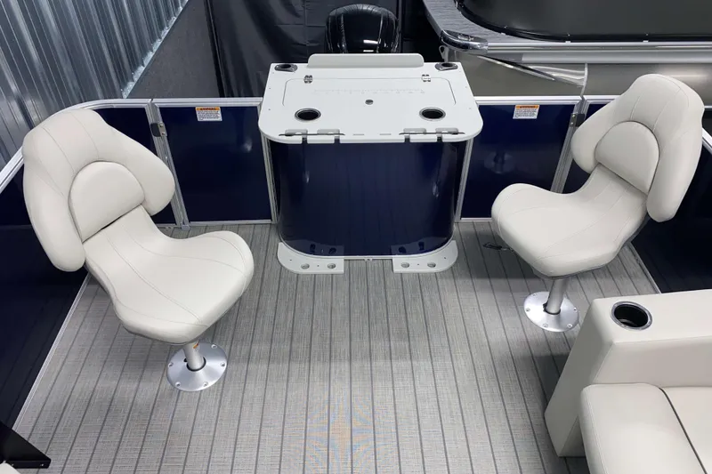 Slide: The Image of 2026 Sylvan Mirage Fish 8520 Party Fish boat interior with swivel chairs and fishing station. - 11