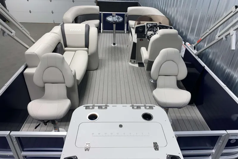 Slide: The Image of 2026 Sylvan Mirage Fish 8520 Party Fish pontoon boat interior with plush seating and modern helm. - 14