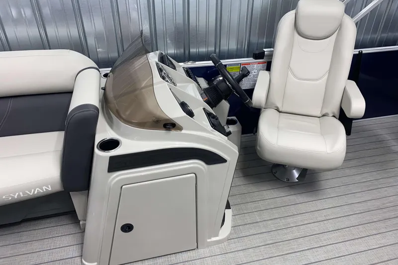 Slide: The Image of 2026 Sylvan Mirage Fish 8520 Party Fish boat interior with steering console and seating. - 6
