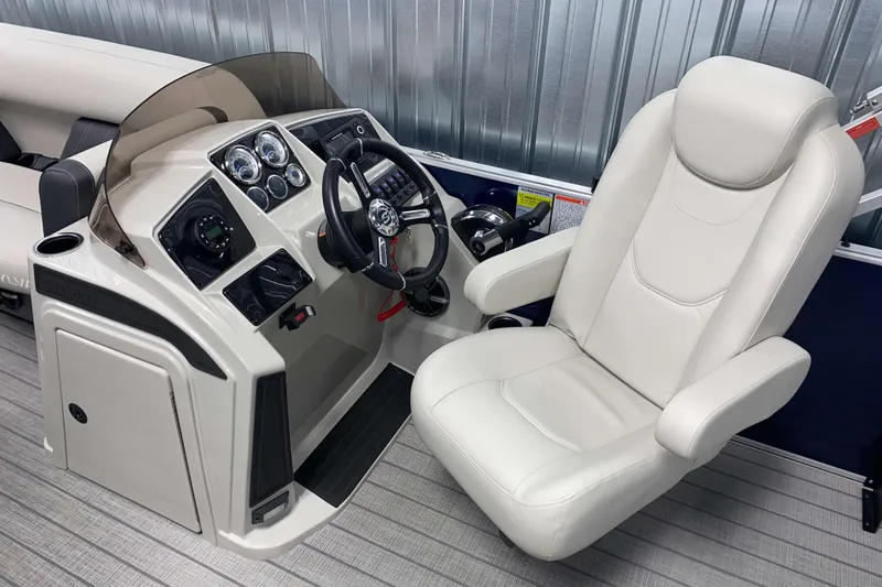Slide: The Image of 2026 Sylvan Mirage Fish 8520 Party Fish boat helm with modern controls and comfortable captain's chair. - 7