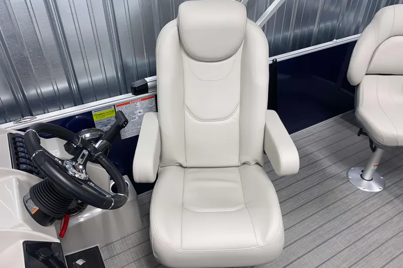 Slide: The Image of Captain's chair and steering wheel of 2026 Sylvan Mirage Fish 8520 Party Fish boat. - 9