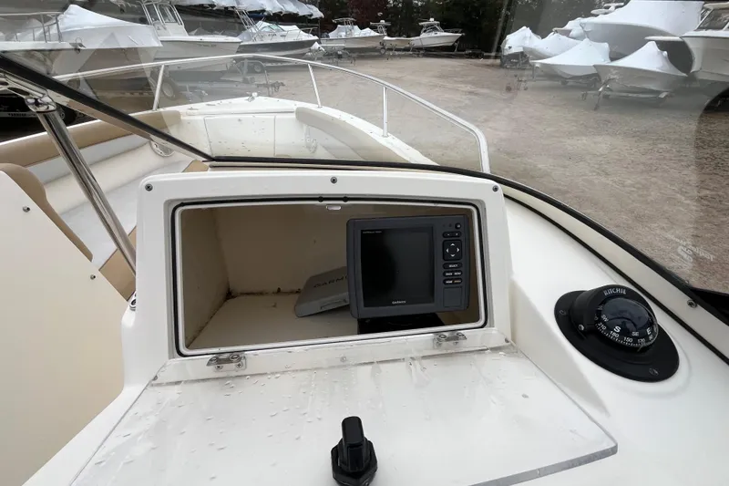 Slide: The Image of 2015 Scout 210 Dorado boat dashboard with Garmin GPS and Ritchie compass. - 16