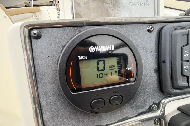 Slide: The Image of Yamaha tachometer on 2015 Scout 210 Dorado boat dashboard, showing 104.1 hours. - 35