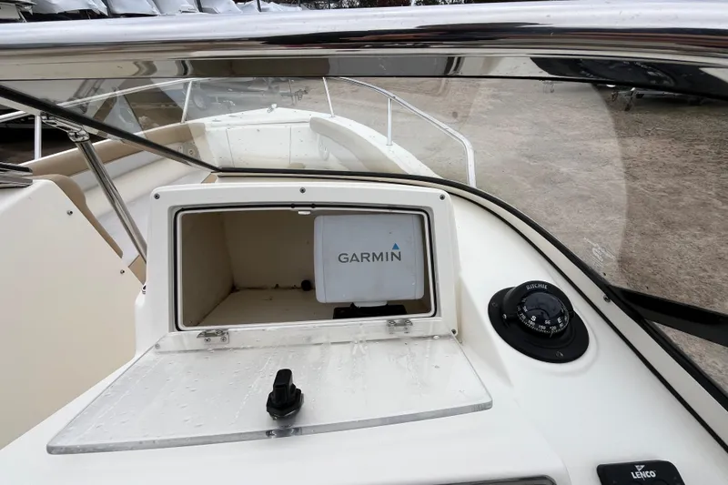 Slide: The Image of 2015 Scout 210 Dorado boat dashboard with Garmin navigation system and compass. - 37