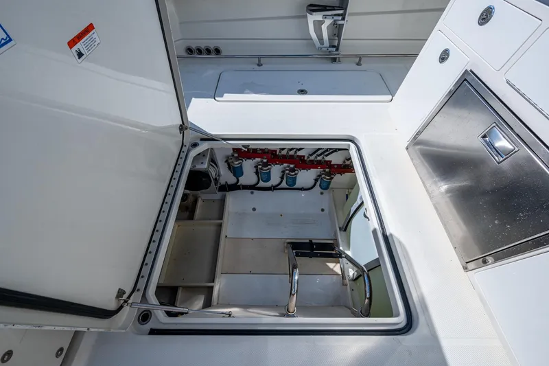 Slide: The Image of 2018 HCB 42 Siesta boat interior with seating and water view. - 14