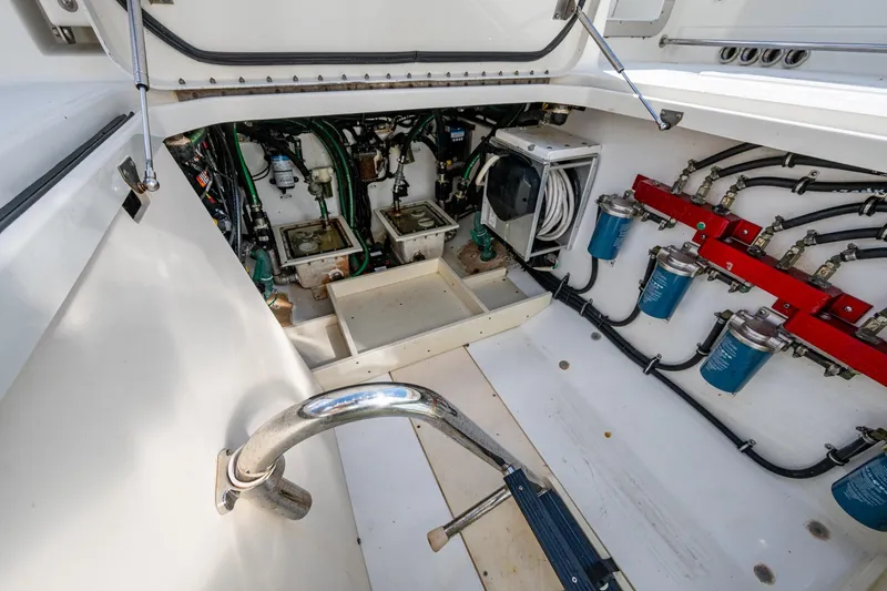 Slide: The Image of 2018 HCB 42 Siesta boat hatch open, revealing interior storage and equipment. - 15