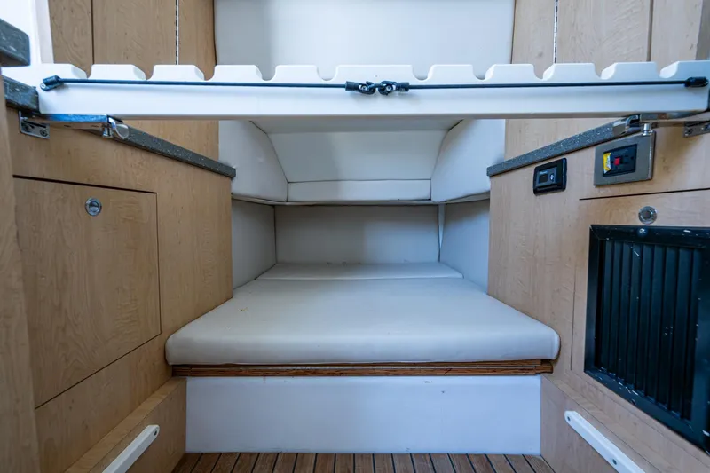 Slide: The Image of 2018 HCB 42 Siesta cabin interior with kitchenette, seating, and bathroom. - 33