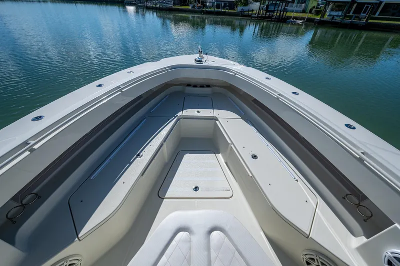 Slide: The Image of 2018 HCB 42 Siesta boat interior with seating, on a sunny day by the water. - 36