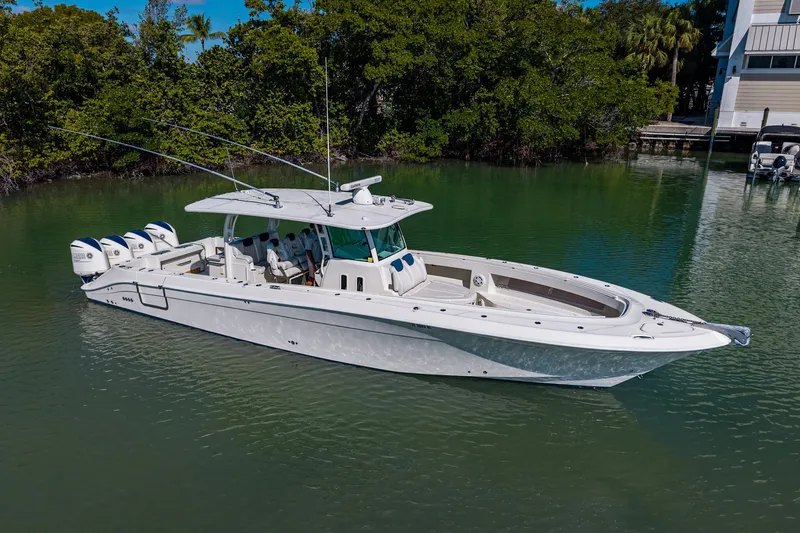 Slide: The Image of 2018 HCB 42 Siesta boat with four engines docked in marina. - 7