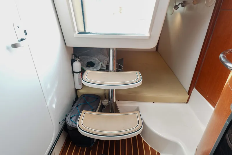 Slide: The Image of Interior of 2007 Boston Whaler 305 Conquest with steps and storage area. - 18