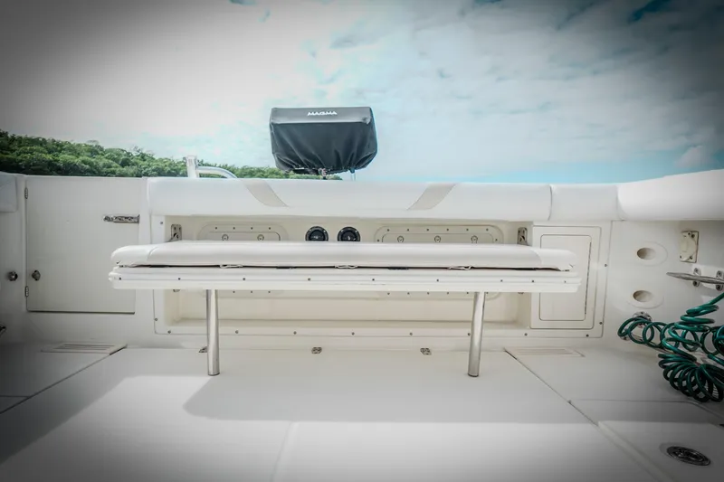 Slide: The Image of 2007 Boston Whaler 305 Conquest boat interior with seating and storage compartments. - 22