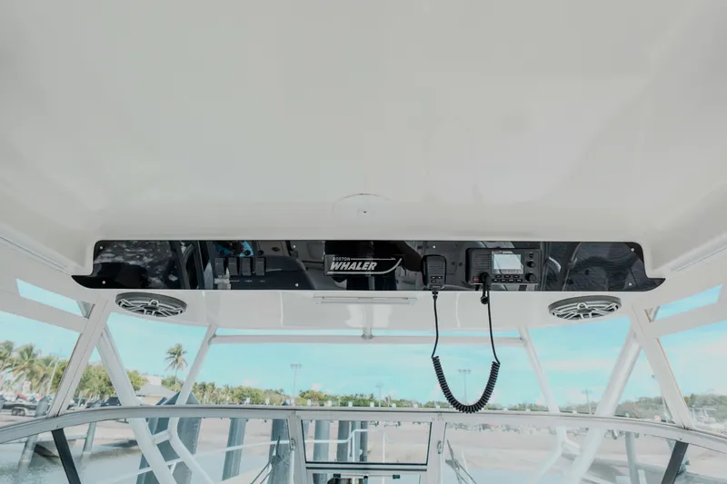 Slide: The Image of 2007 Boston Whaler 305 Conquest boat interior with control panel and communication equipment. - 32