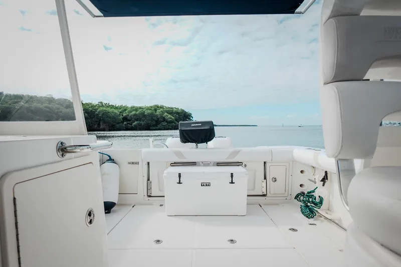 Slide: The Image of 2007 Boston Whaler 305 Conquest boat interior with ocean view and seating area. - 36