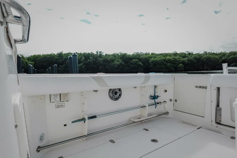 Slide: The Image of 2007 Boston Whaler 305 Conquest boat interior with white seating and scenic water view. - 37