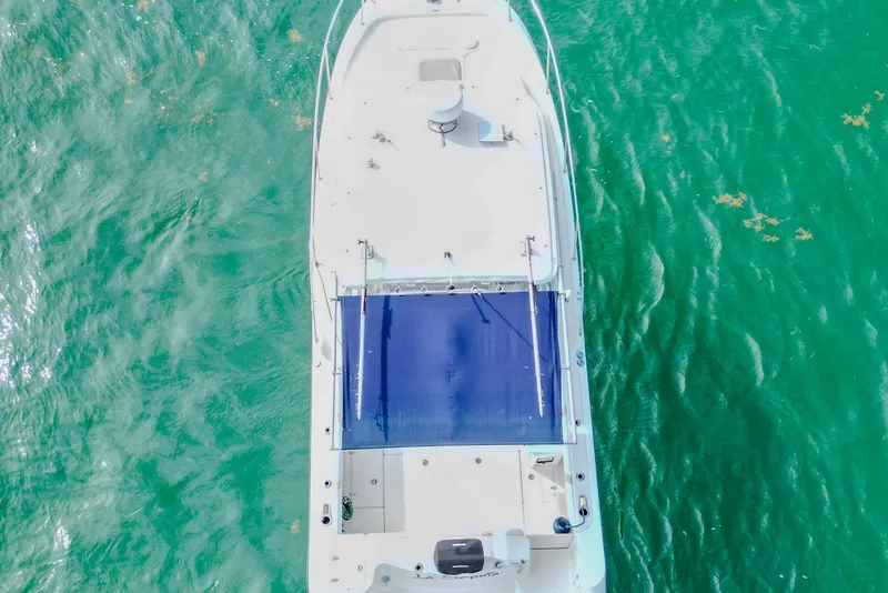 Slide: The Image of Aerial view of 2007 Boston Whaler 305 Conquest on turquoise water. - 8