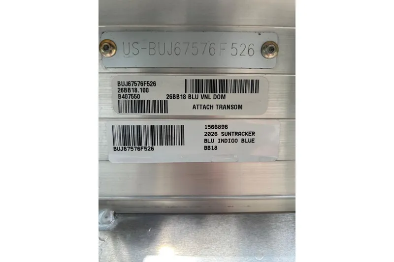 Slide: The Image of 2026 Sun Tracker Bass Buggy 18 DLX identification labels with serial numbers and model details. - 16