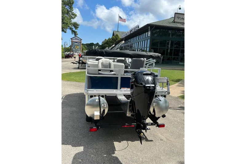 Slide: The Image of 2026 Sun Tracker Bass Buggy 18 DLX pontoon boat with Mercury outboard motor. - 8