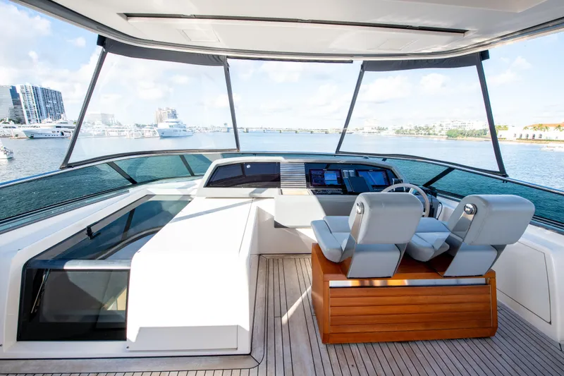 Slide: The Image of Helm of 2016 Sanlorenzo SL86 yacht with modern controls and panoramic view. - 11