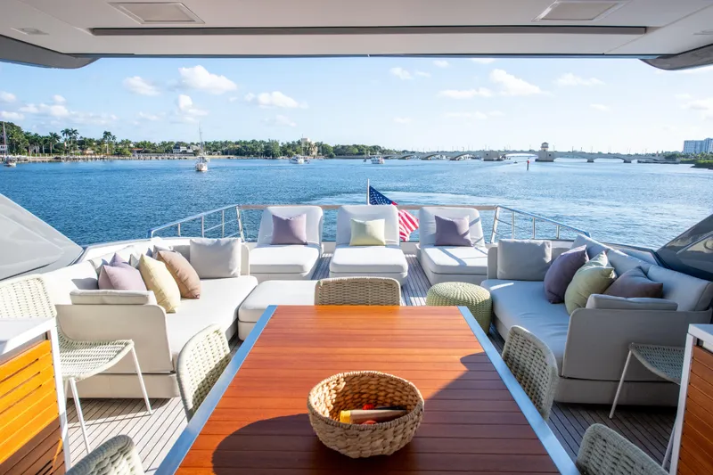 Slide: The Image of Luxurious 2016 Sanlorenzo SL86 yacht deck with elegant seating, overlooking serene waters. - 12