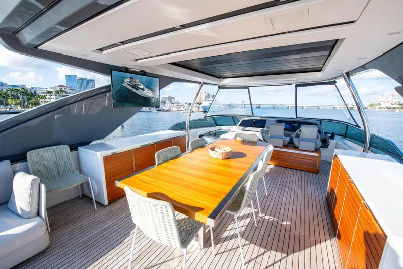 Slide: The Image of Luxurious 2016 Sanlorenzo SL86 yacht deck with elegant seating and dining area. - 13