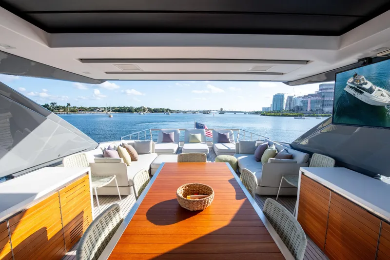 Slide: The Image of Luxurious 2016 Sanlorenzo SL86 yacht deck with elegant seating and waterfront view. - 8