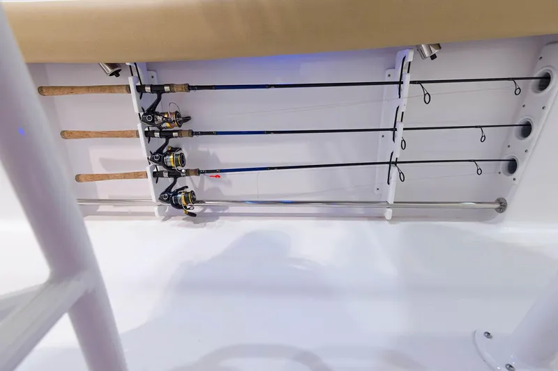 Slide: The Image of Interior view of 2021 Sportsman Open 242 Center Console with blue lighting and speakers. - 14