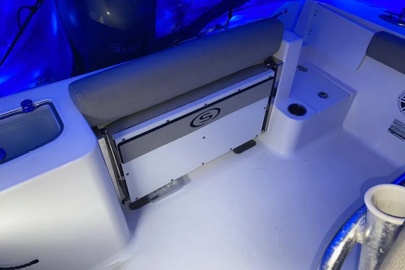 Slide: The Image of 2021 Sportsman Open 242 Center Console boat interior with seating and storage. - 19