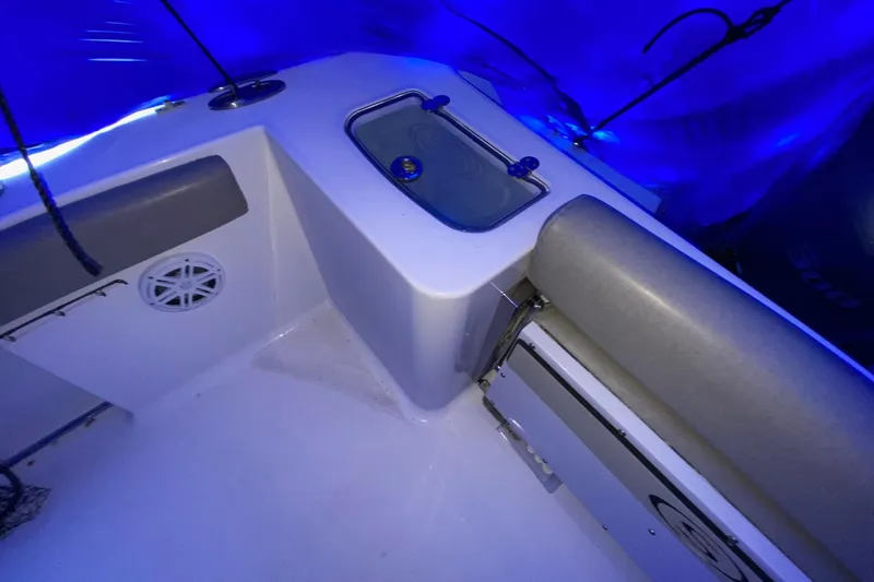 Slide: The Image of 2021 Sportsman Open 242 Center Console boat interior with blue LED lighting. - 22
