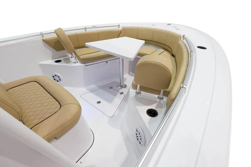 Slide: The Image of Manufacturer Provided Image: 2021 Sportsman Open 242 Center Console boat with tan seating and white table. - 29